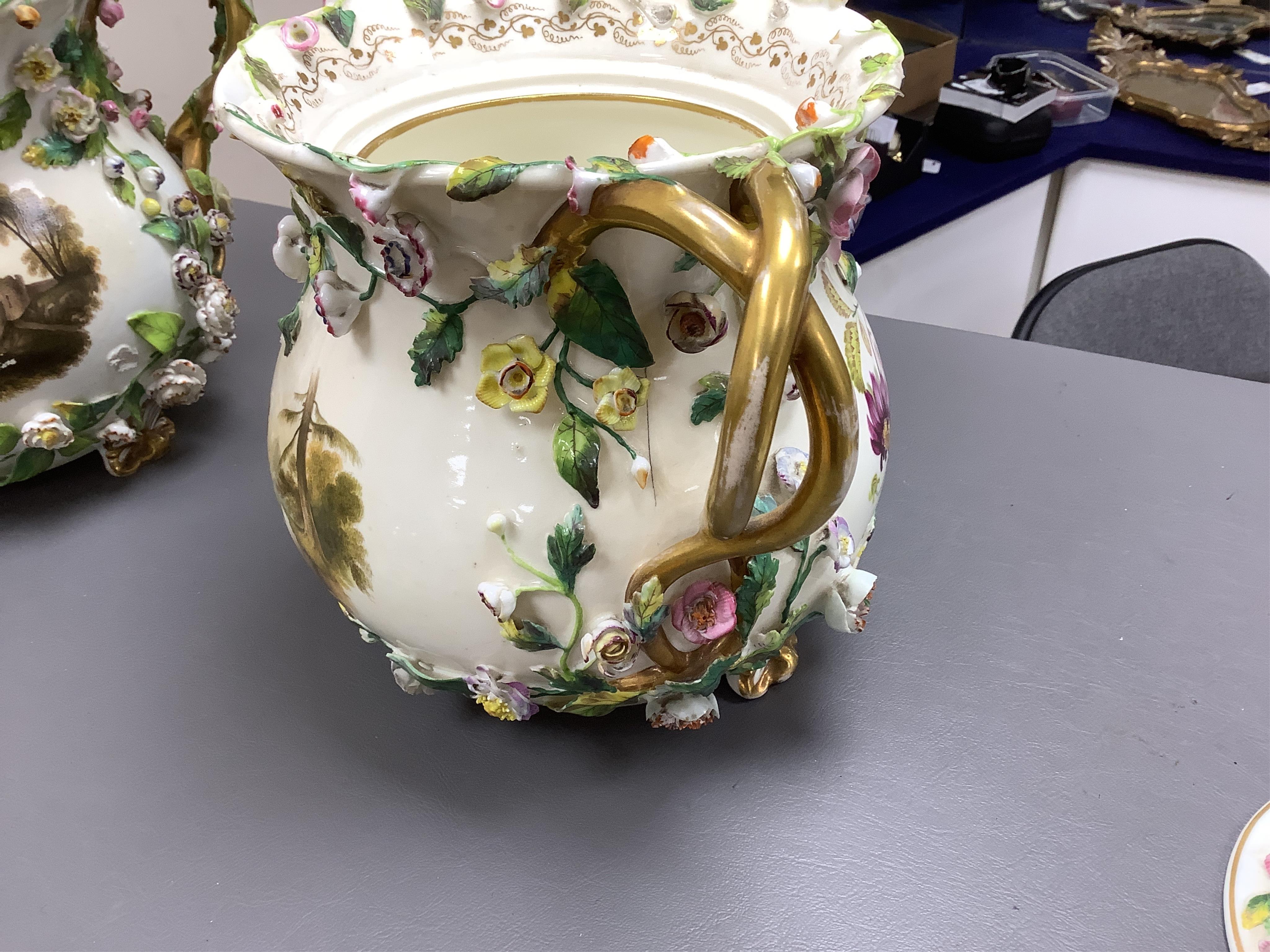 A pair of Rockingham two handled pot pourri vases and covers, c.1830-42, the first painted with two named views near Lyme, Dorsetshire and Stockly Bridge’, The second with an unnamed view of a monument by a lake, the rev